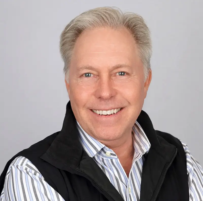 Headshot of Bruce Dahlgren with a play button